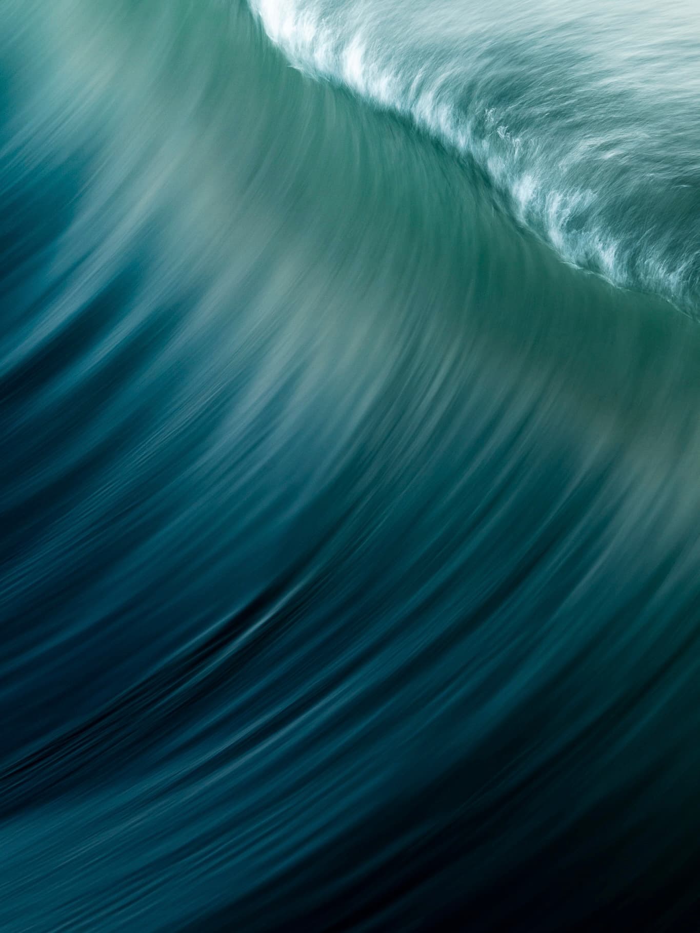 Close crop of a breaking teal wave
